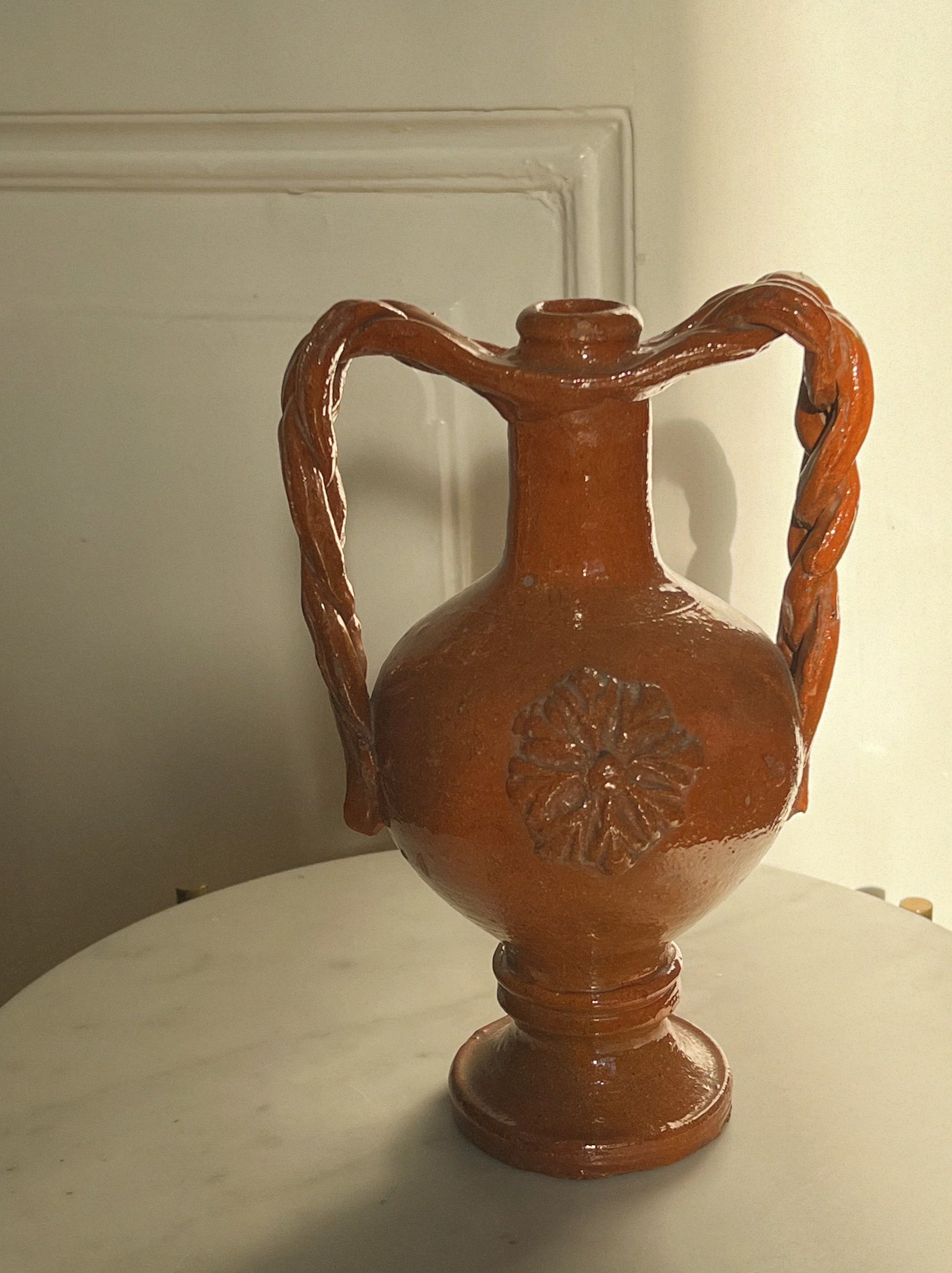 Glazed antique amphora braided