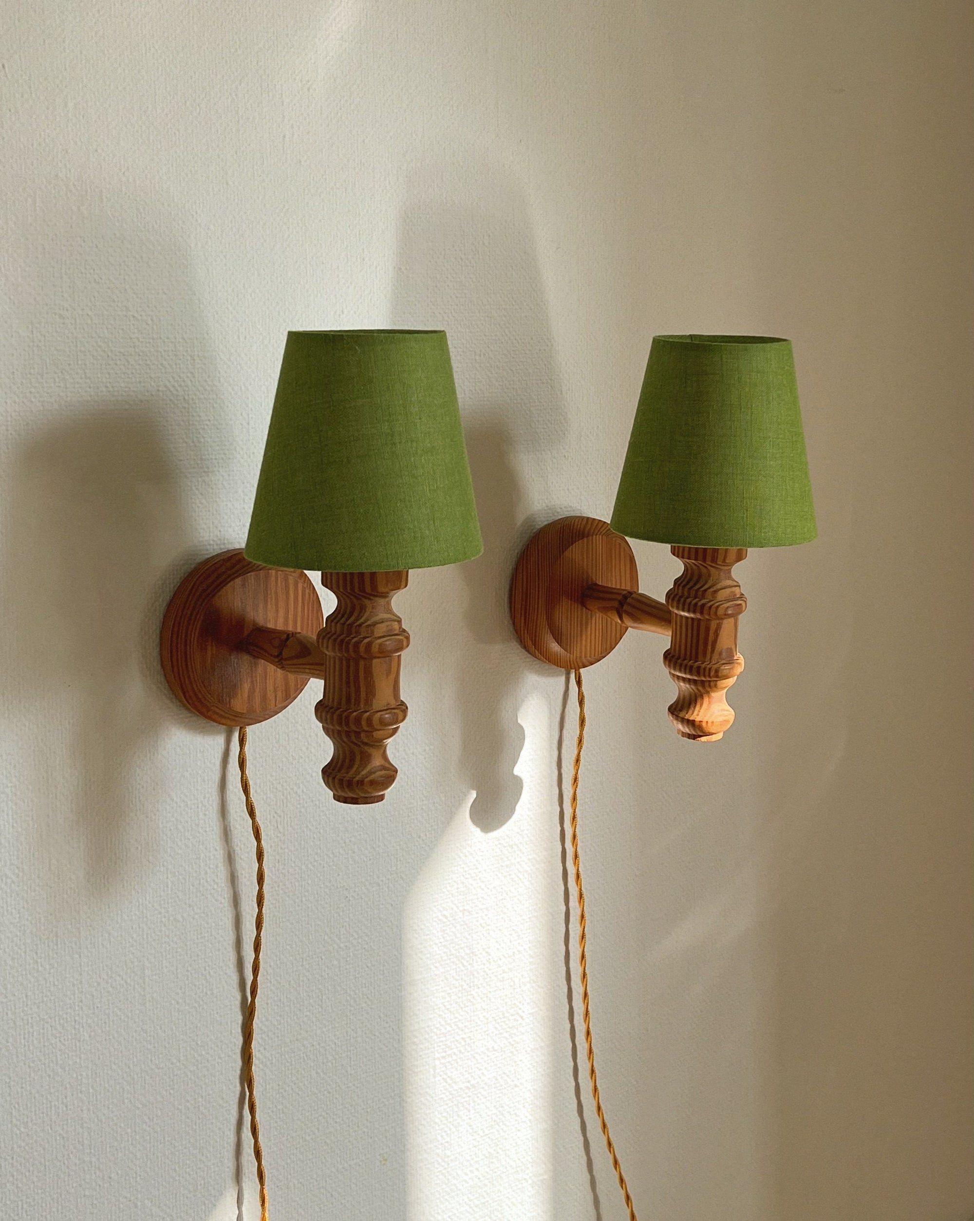 Pair of turned wall lamps
