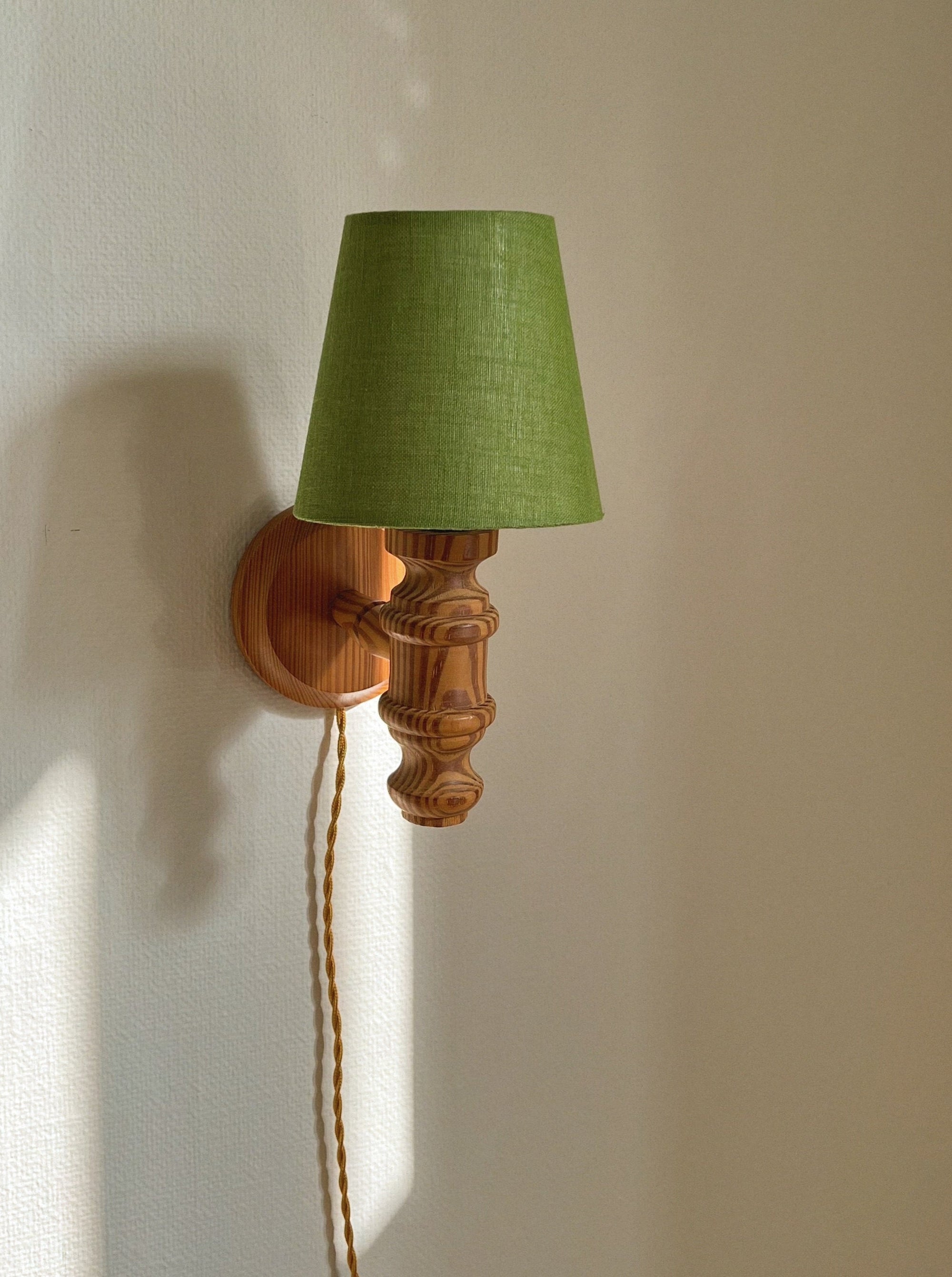 Pair of turned wall lamps